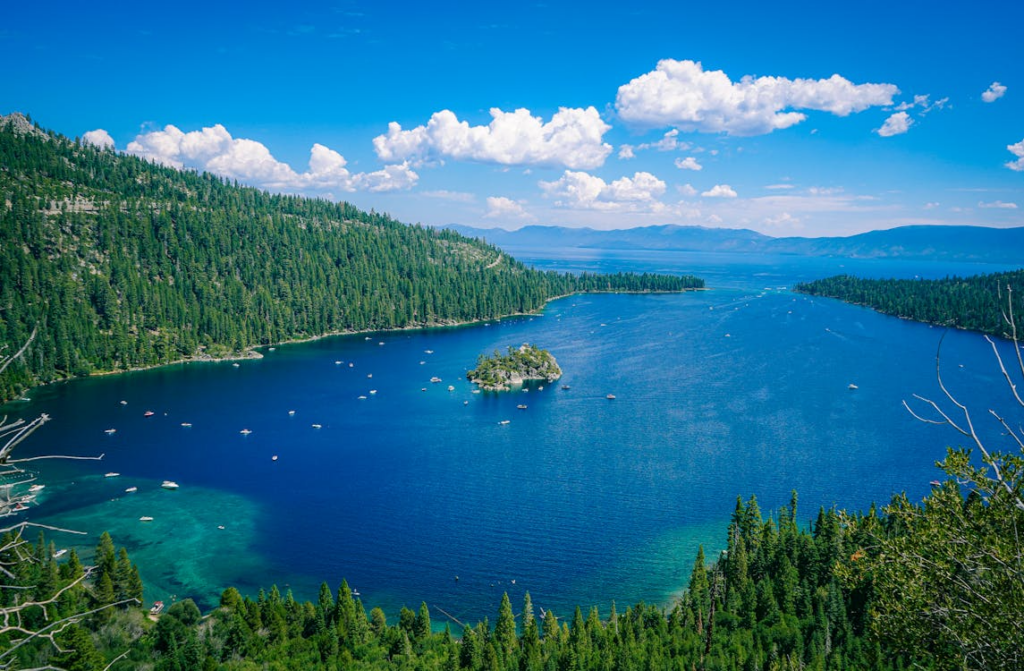 lakes that look like oceans with wide blue water, forested shoreline, and mountain views
