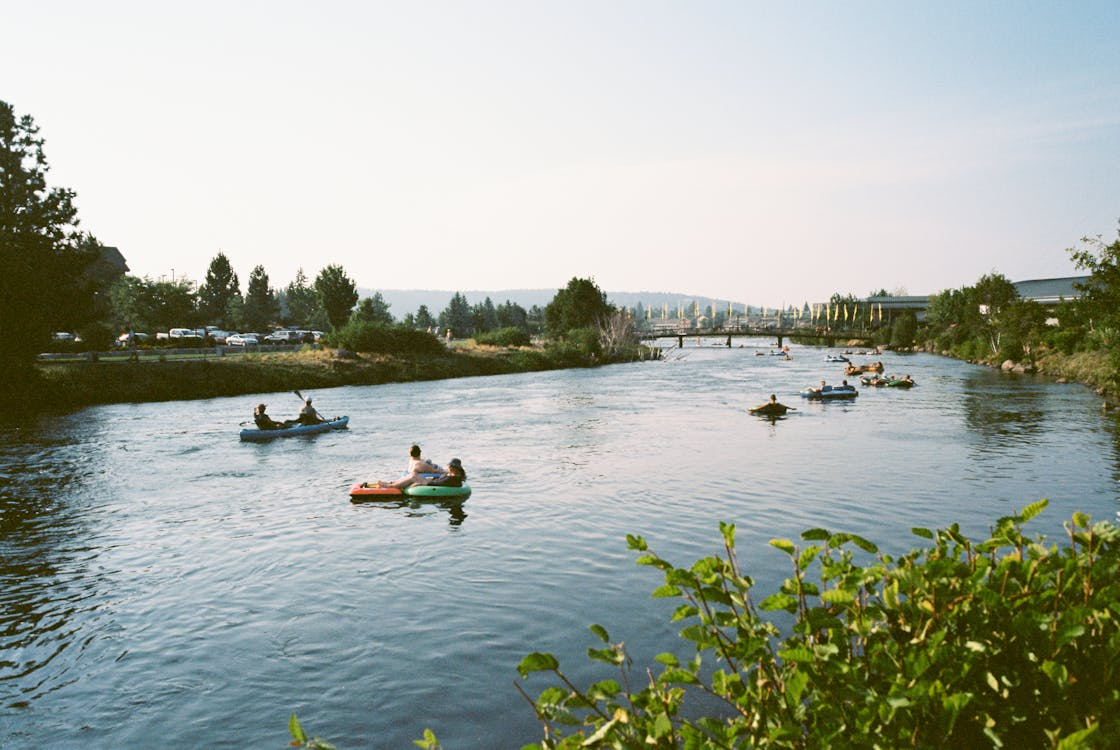 natural lazy rivers for tubing with people floating down a calm scenic river