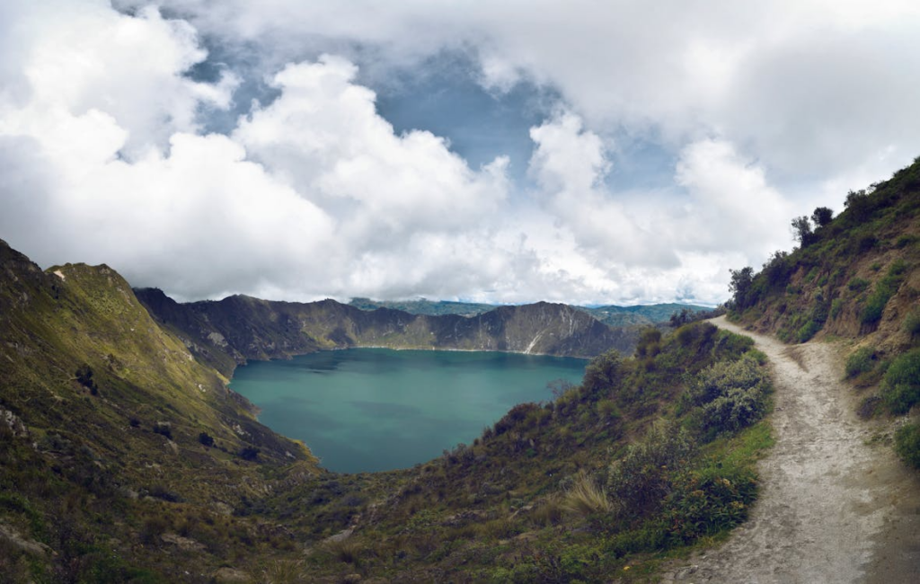 Why do lakes explode shown through a volcanic crater lake surrounded by steep mountain slopes.