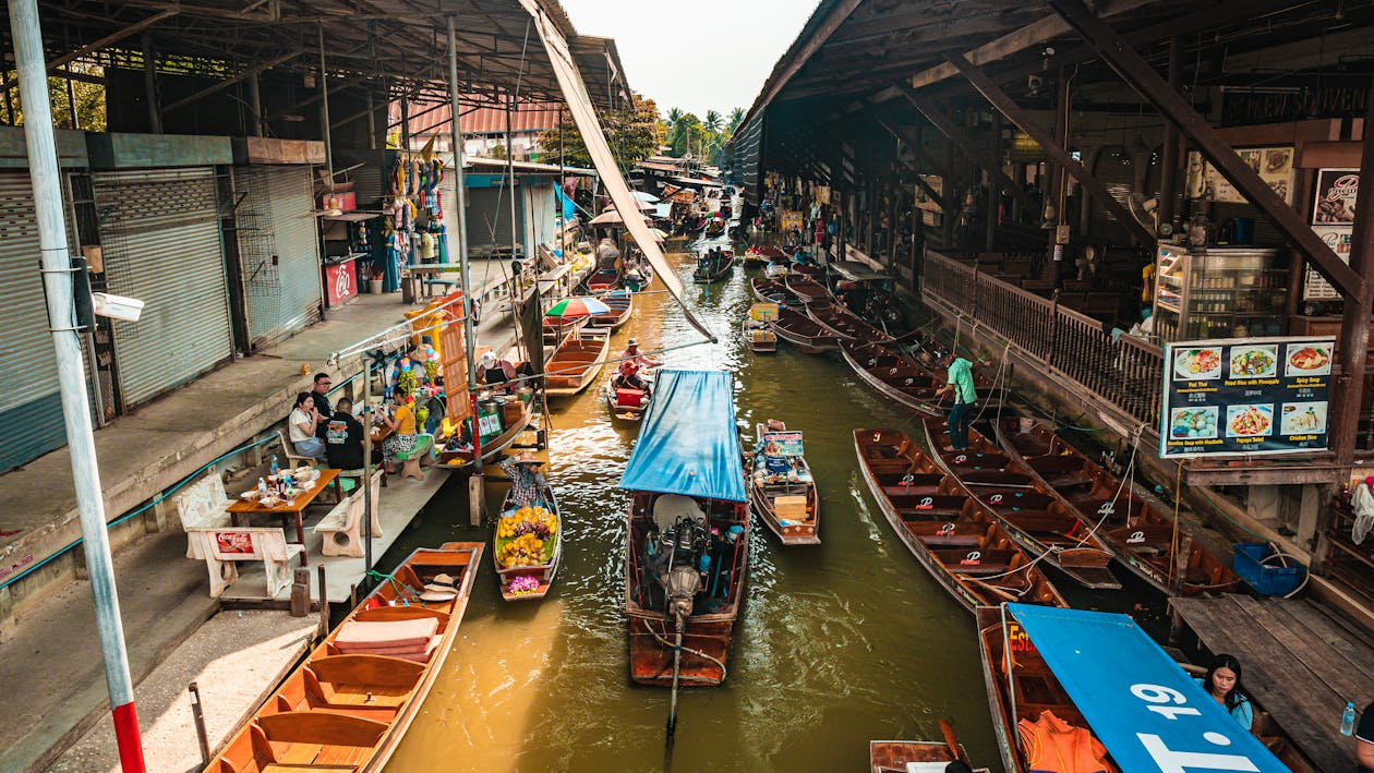 floating markets around the world with wooden boats, canal vendors, and waterfront food stalls